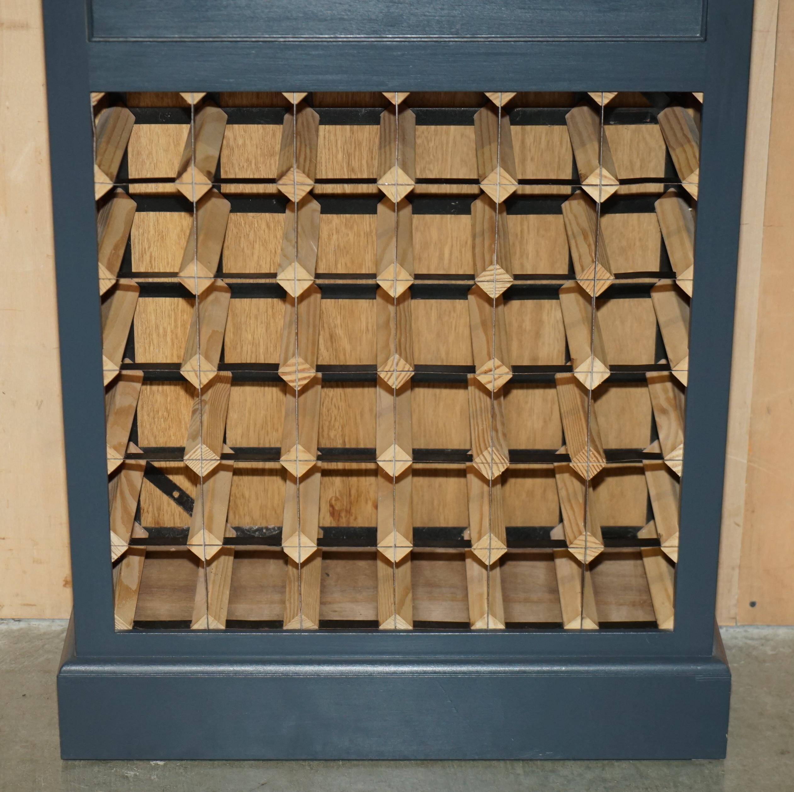 Vintage wine rack furniture for 36 bottles with drawer.