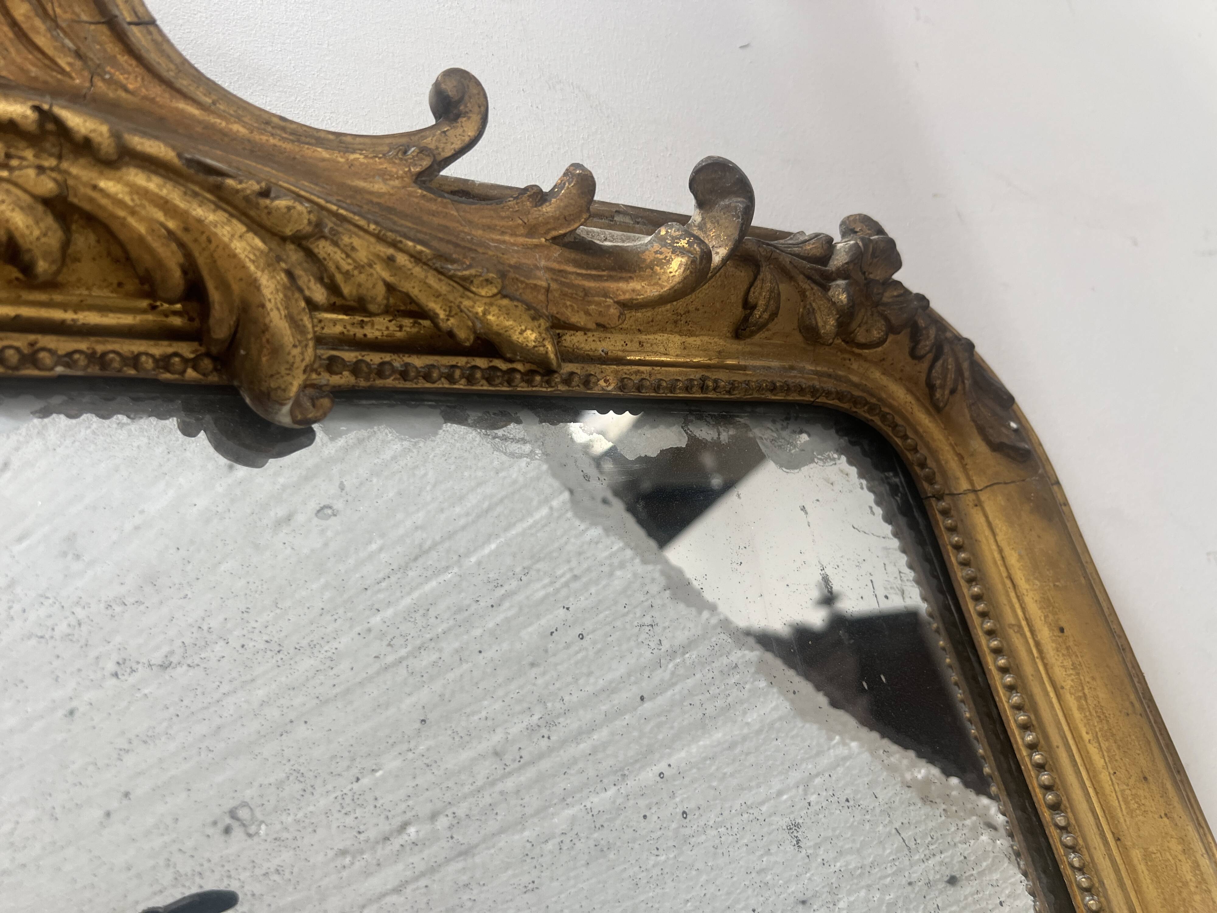 Louis XV style mirror in gilded wood and stucco
