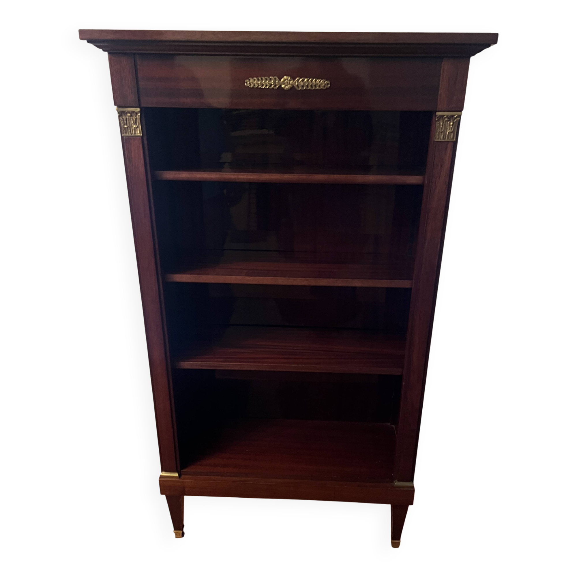 Directoire style bookcase in mahogany, decorated with gilded bronze.