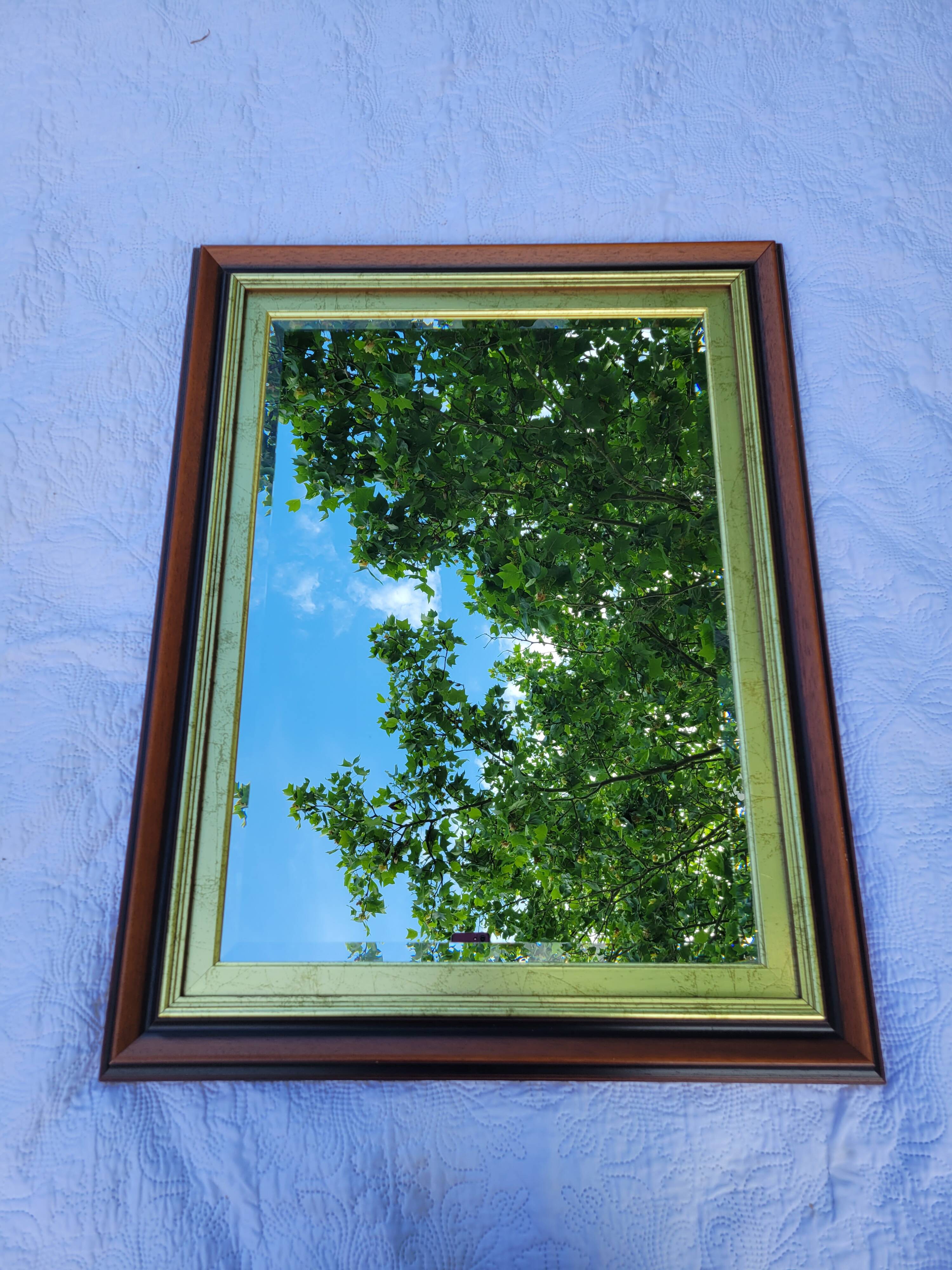 Large wooden and gold mirror