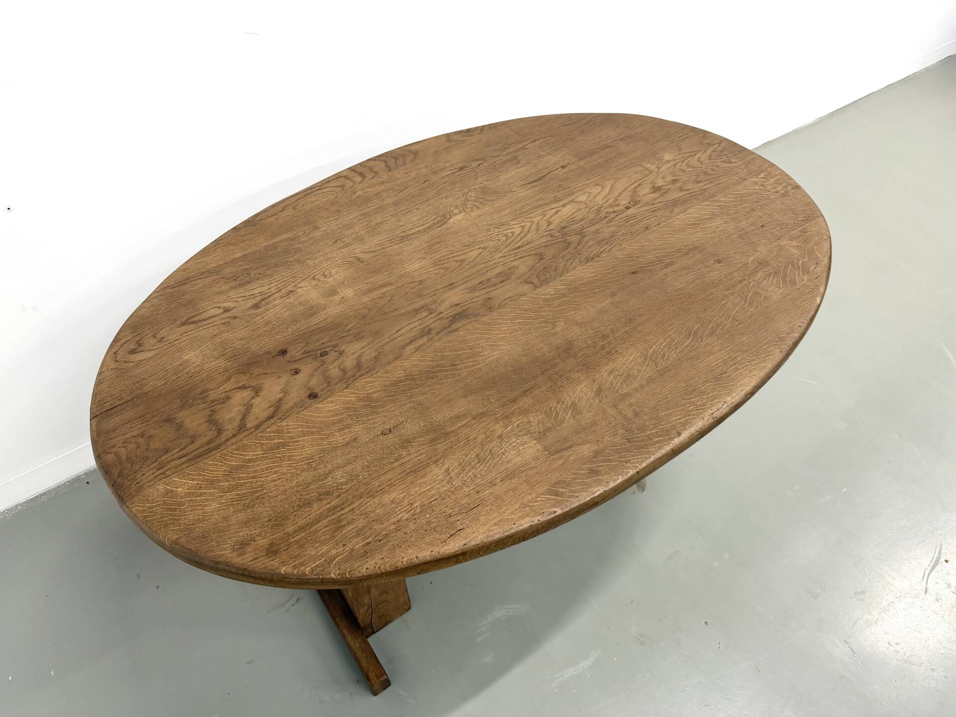 Oval table with T-shaped legs, solid oak, student woodworking project.