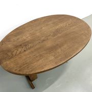 Oval table with T-shaped legs, solid oak, student woodworking project.