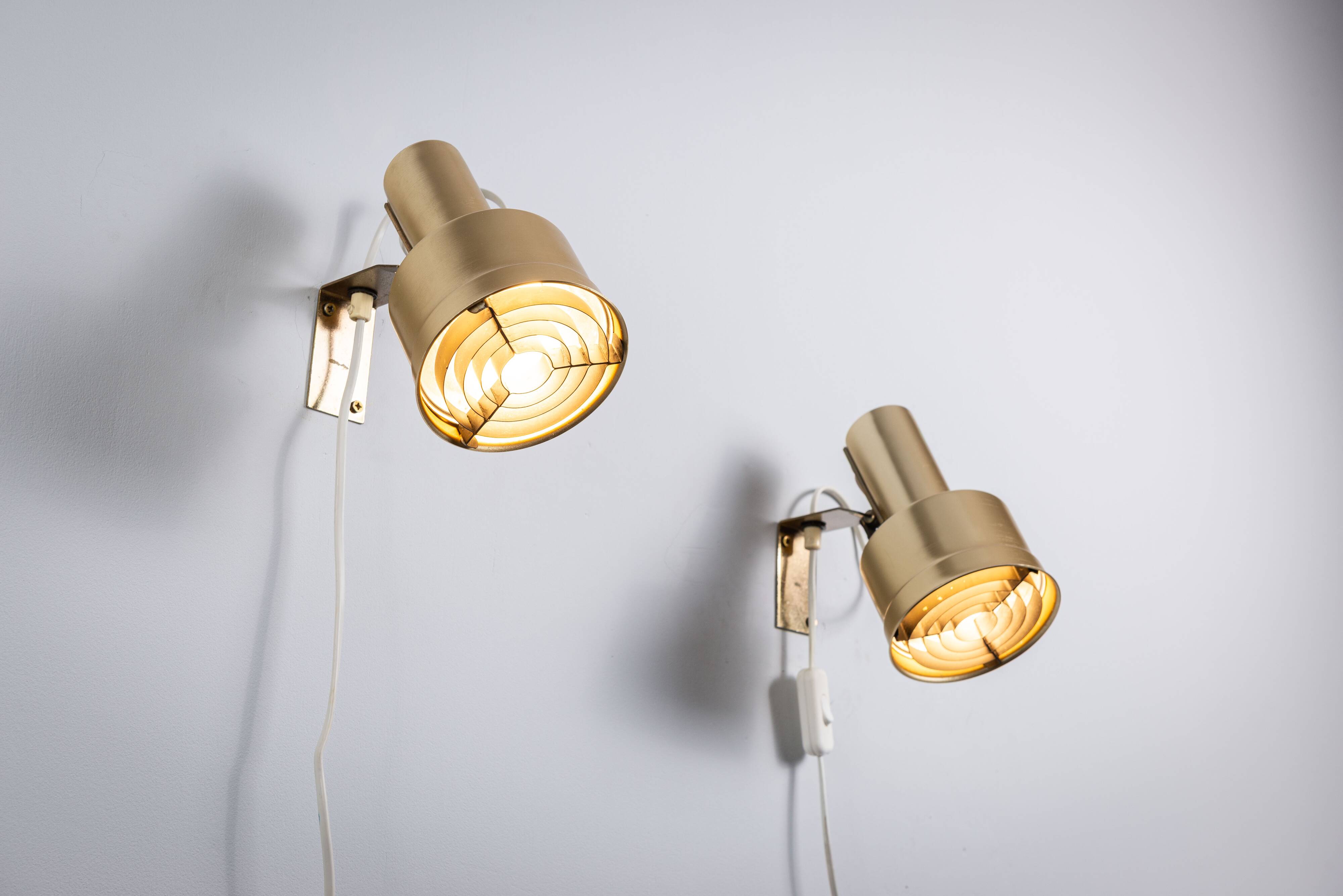 Pair of adjustable wall lamps designed by Per Sundstedt for Kosta Lampan