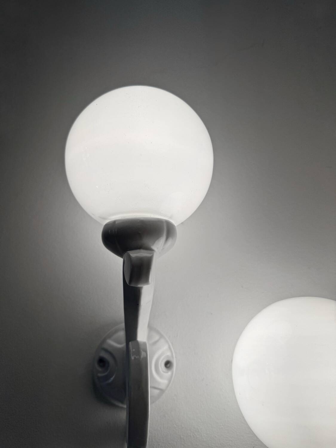 Cast iron and opaline wall lights from the 70s