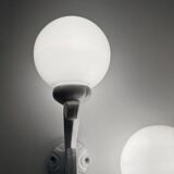 Cast iron and opaline wall lights from the 70s