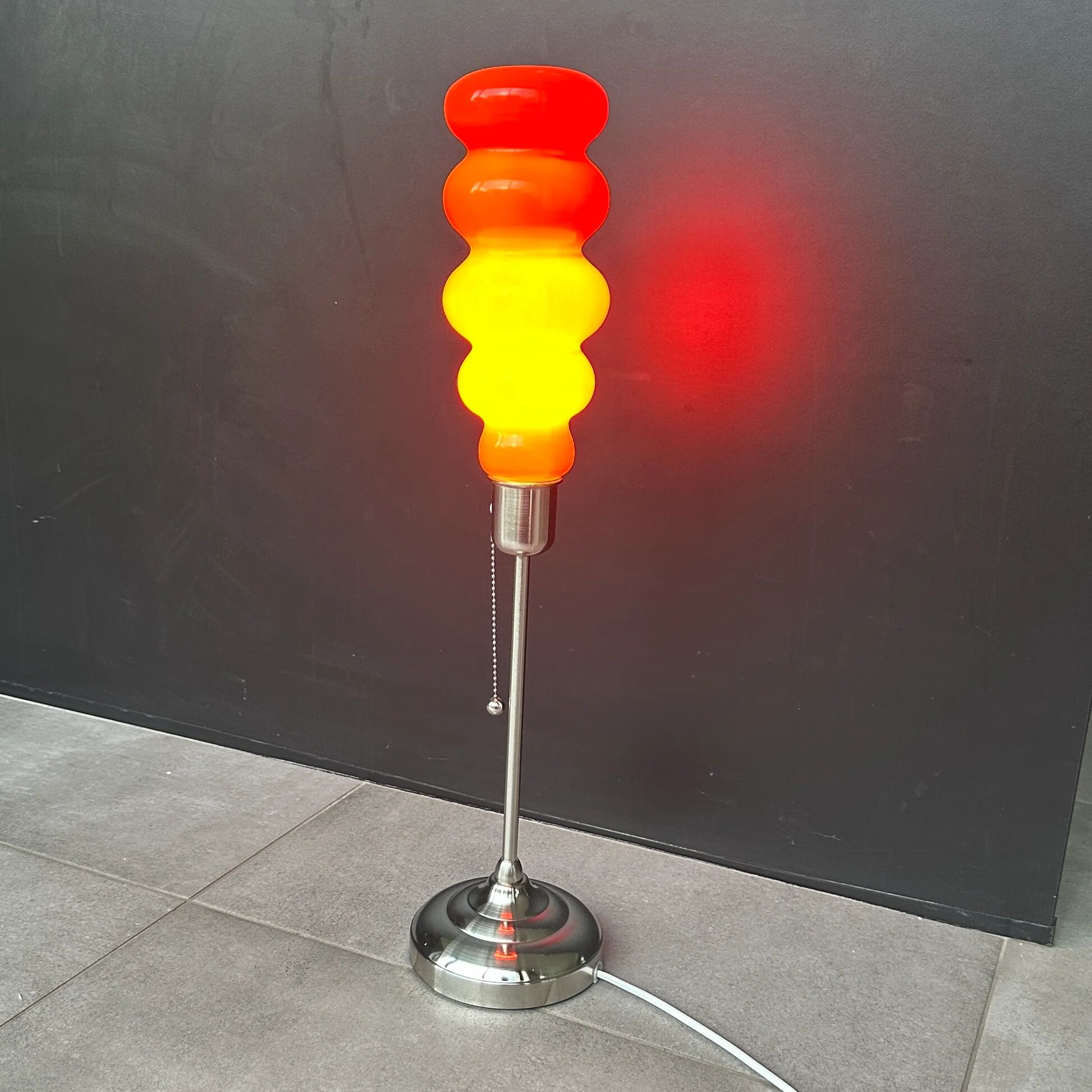 Modern vintage pop design lamp in 70’s style orange glass