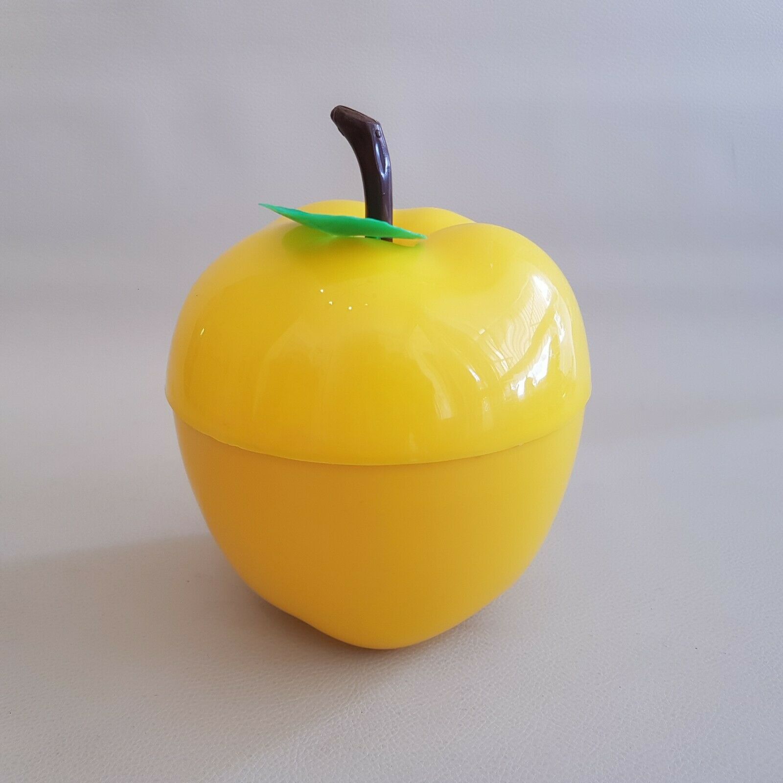 Vintage yellow apple-shaped plastic ice cube tray