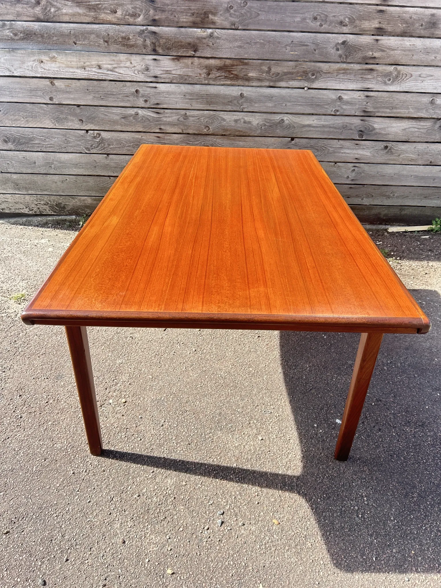 Rectangular extendable table in Scandinavian style made of teak.