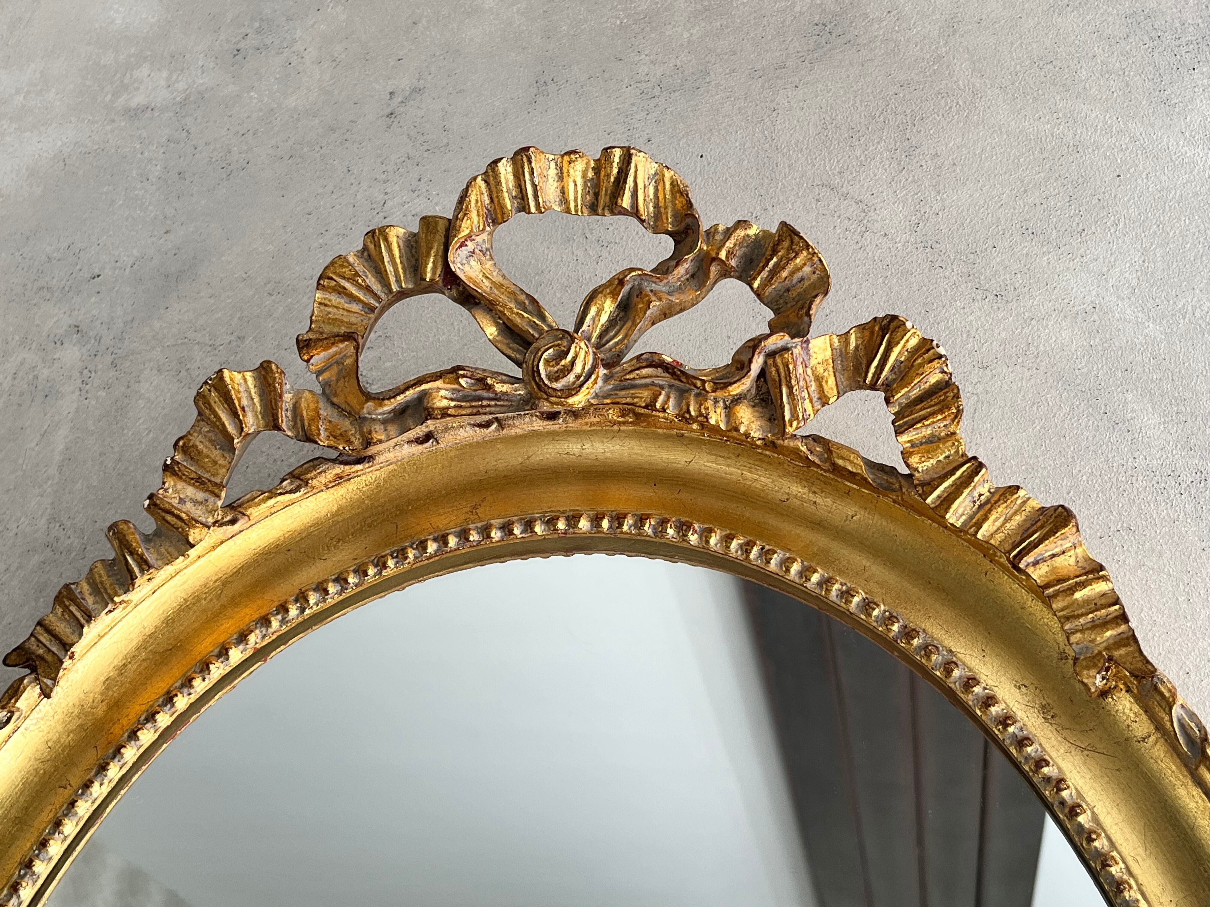 Gilded mirror with pediment