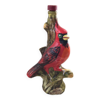 Garnier decorative bottle with red cardinal bird pattern