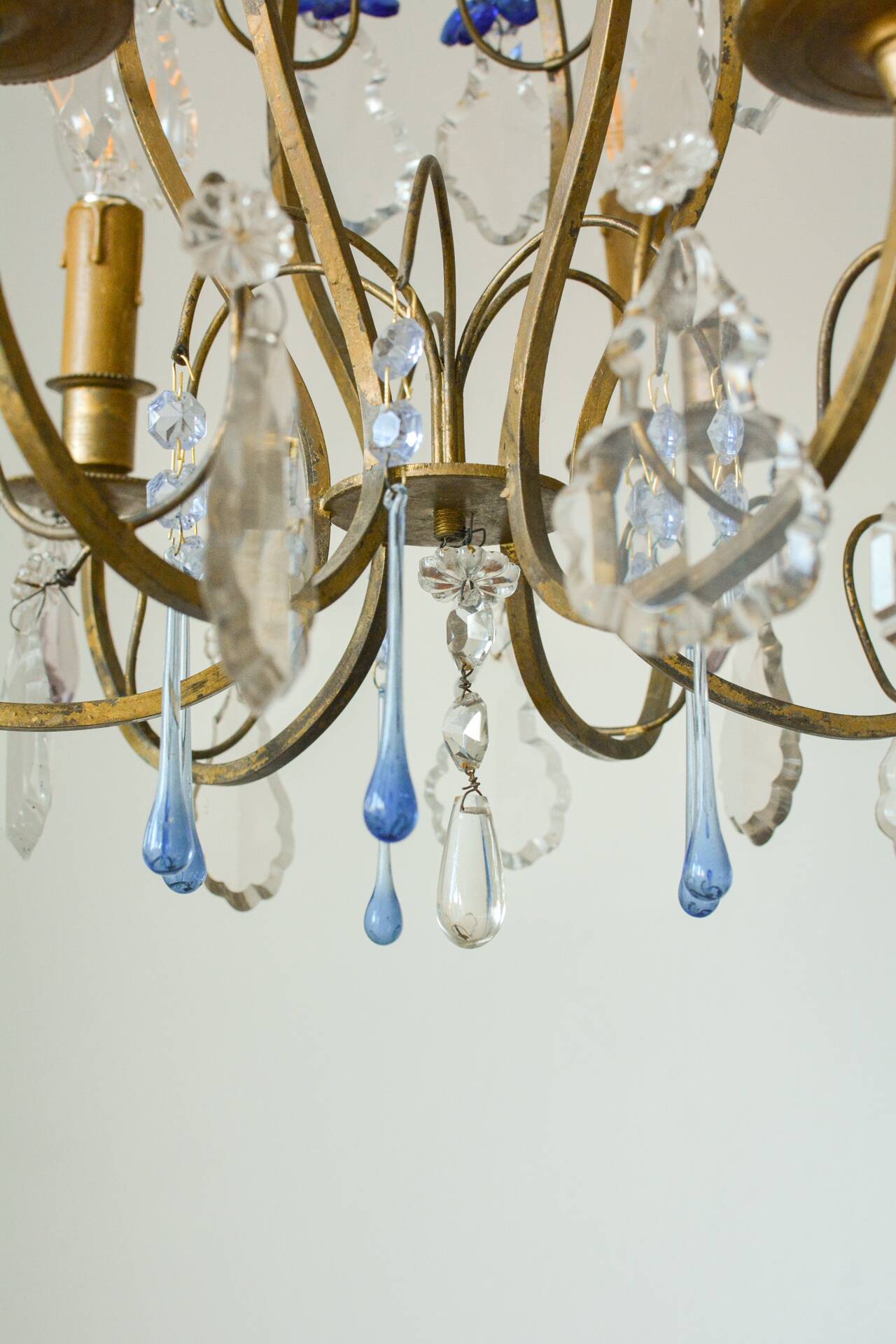 Antique French chandelier cage in gilded bronze and crystal, with blue pendants.