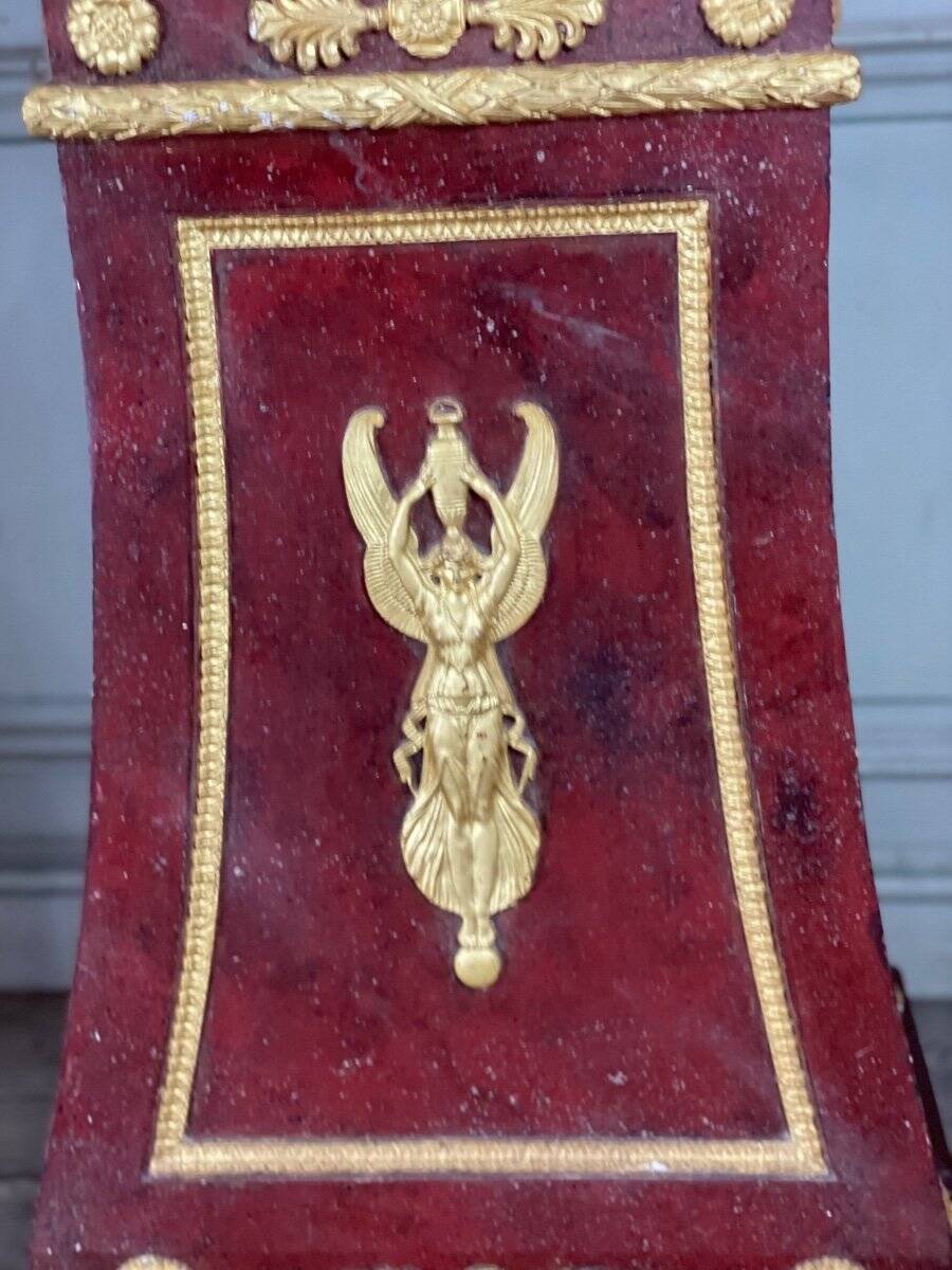 Pair of plaster bases imitating porphyry and gilded bronze circa 1980.