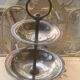 Double cup display in vintage silver metal