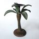 Antique palm tree-shaped candlestick in patinated metal