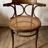 Cane and curved wood armchair