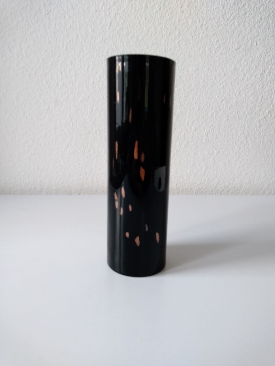 Black opaque glass vase with minimalist style copper inlays
