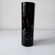 Black opaque glass vase with minimalist style copper inlays