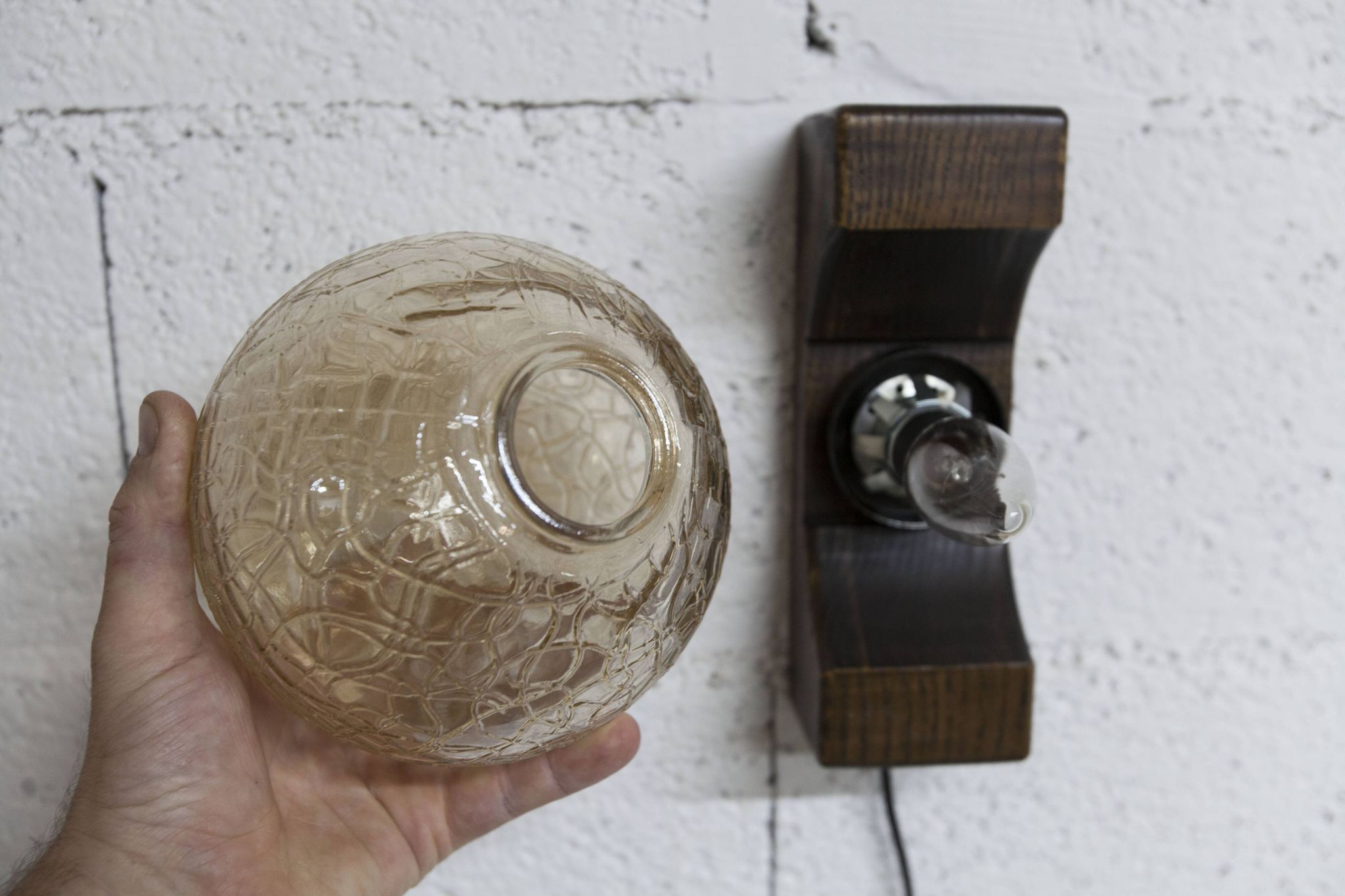 1960s ball wall light in dark wood and amber glass