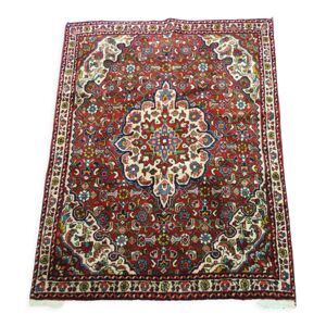 Tapis persan authentique milieu