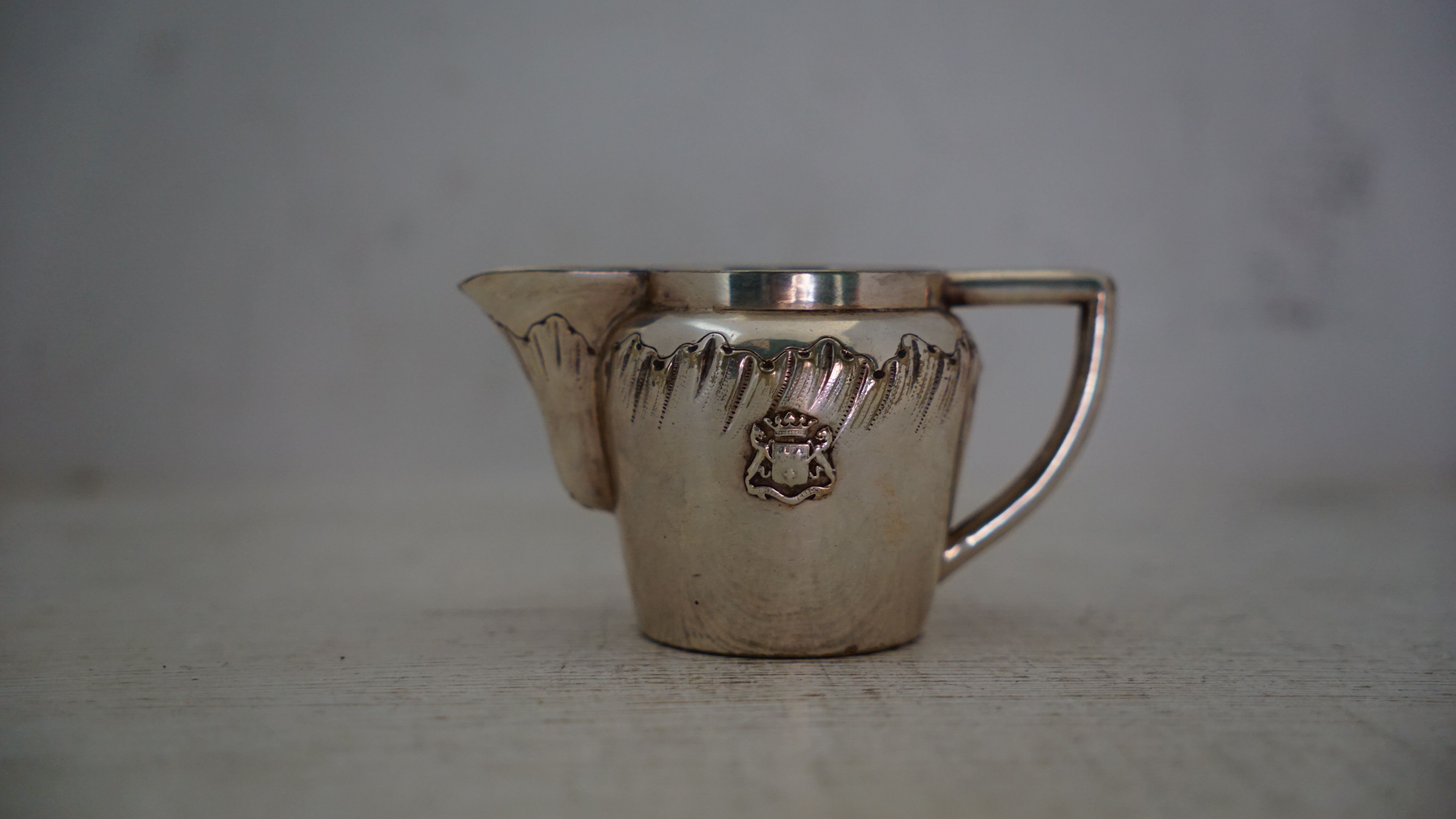 Teapot and milk jug English silverware