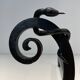 Paire de Chenets en Fer Forgé Modèle aux Serpents dans le Goût d’Edgar Bran