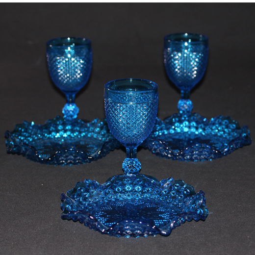 Old table set in blue pressed moulded glass