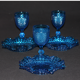 Old table set in blue pressed moulded glass