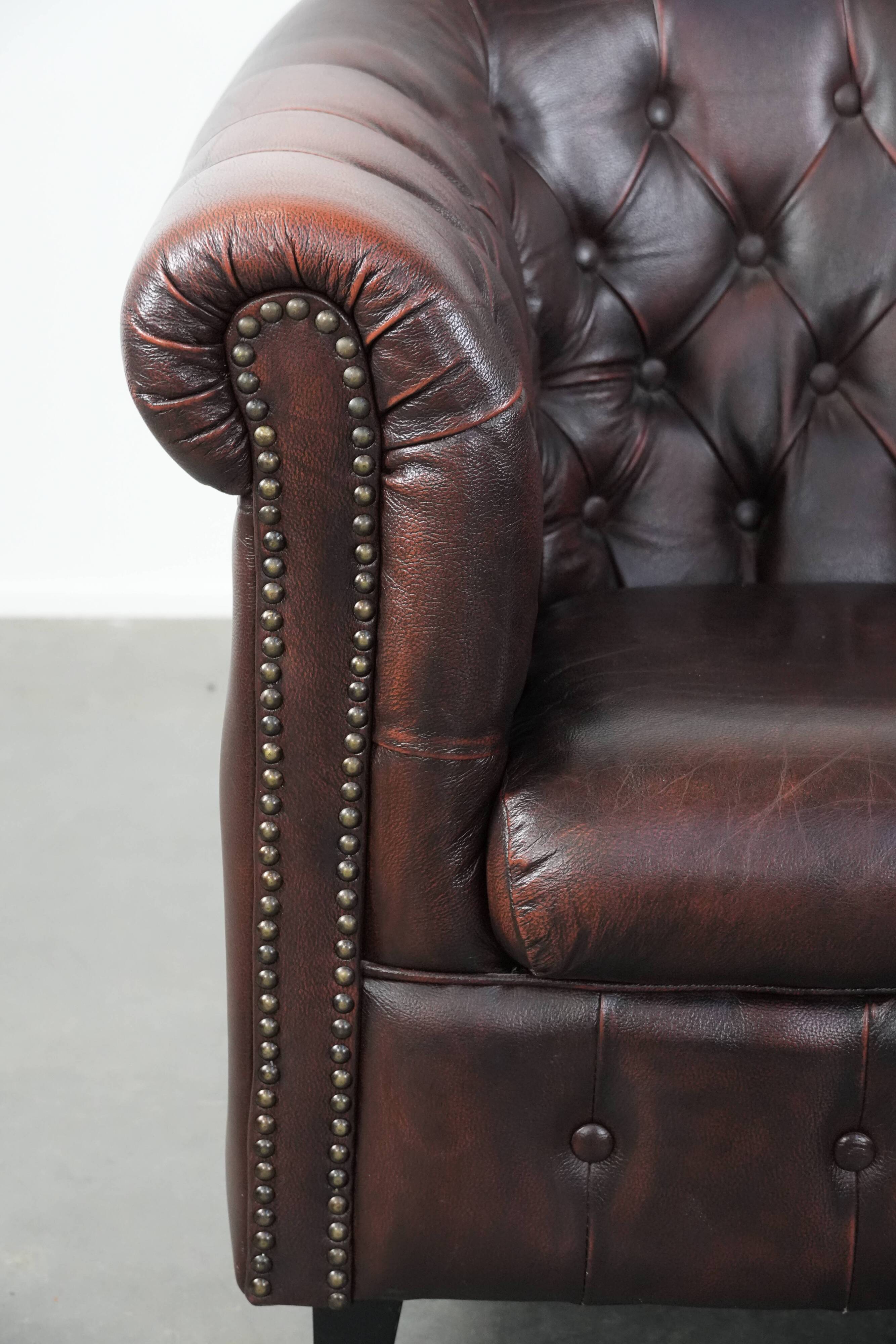 Classic English-style Chesterfield club armchair in cowhide leather