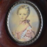 Miniature portrait of a young girl, framed and under glass