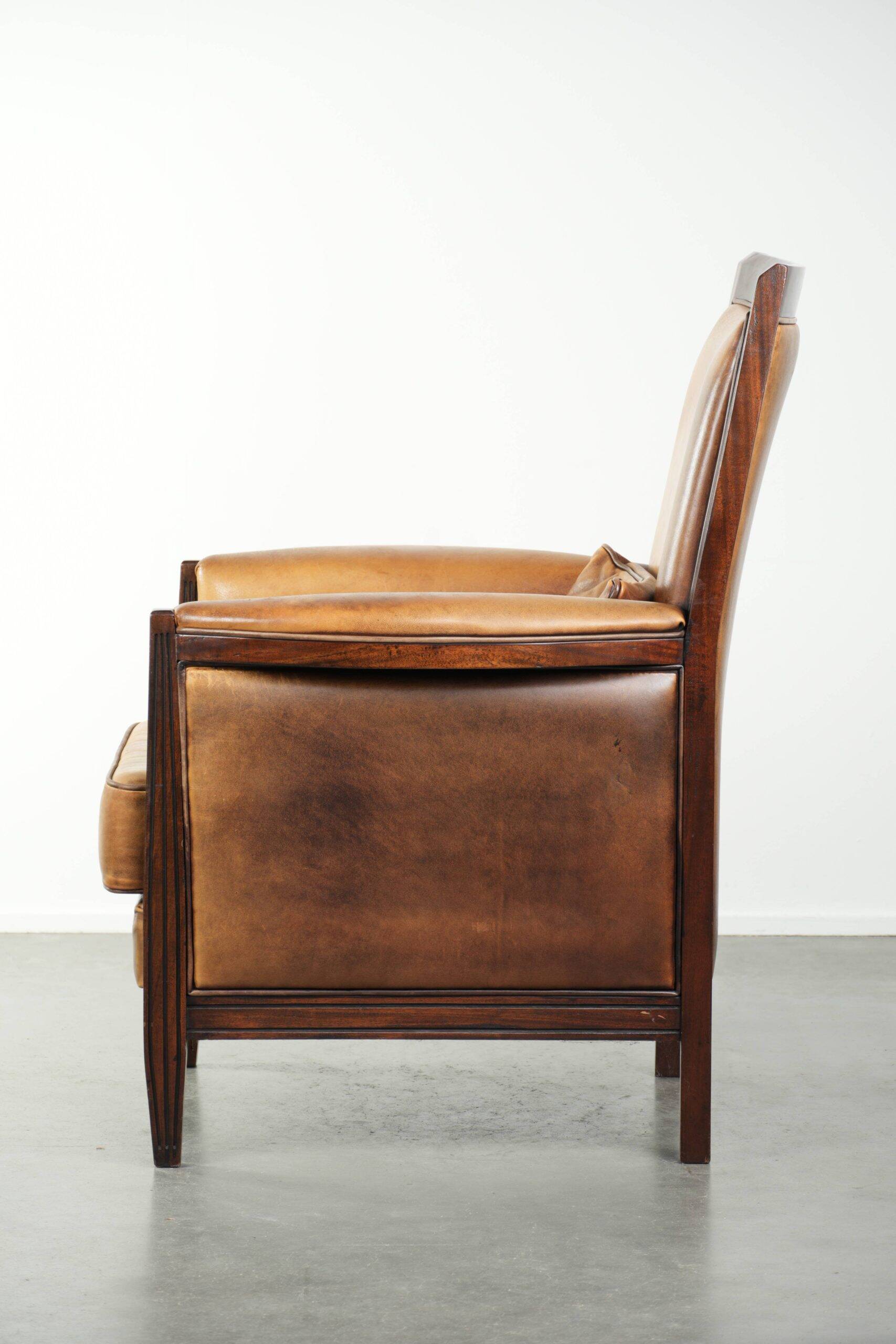Cognac-coloured Art Deco design armchair made of sheepskin with a high back