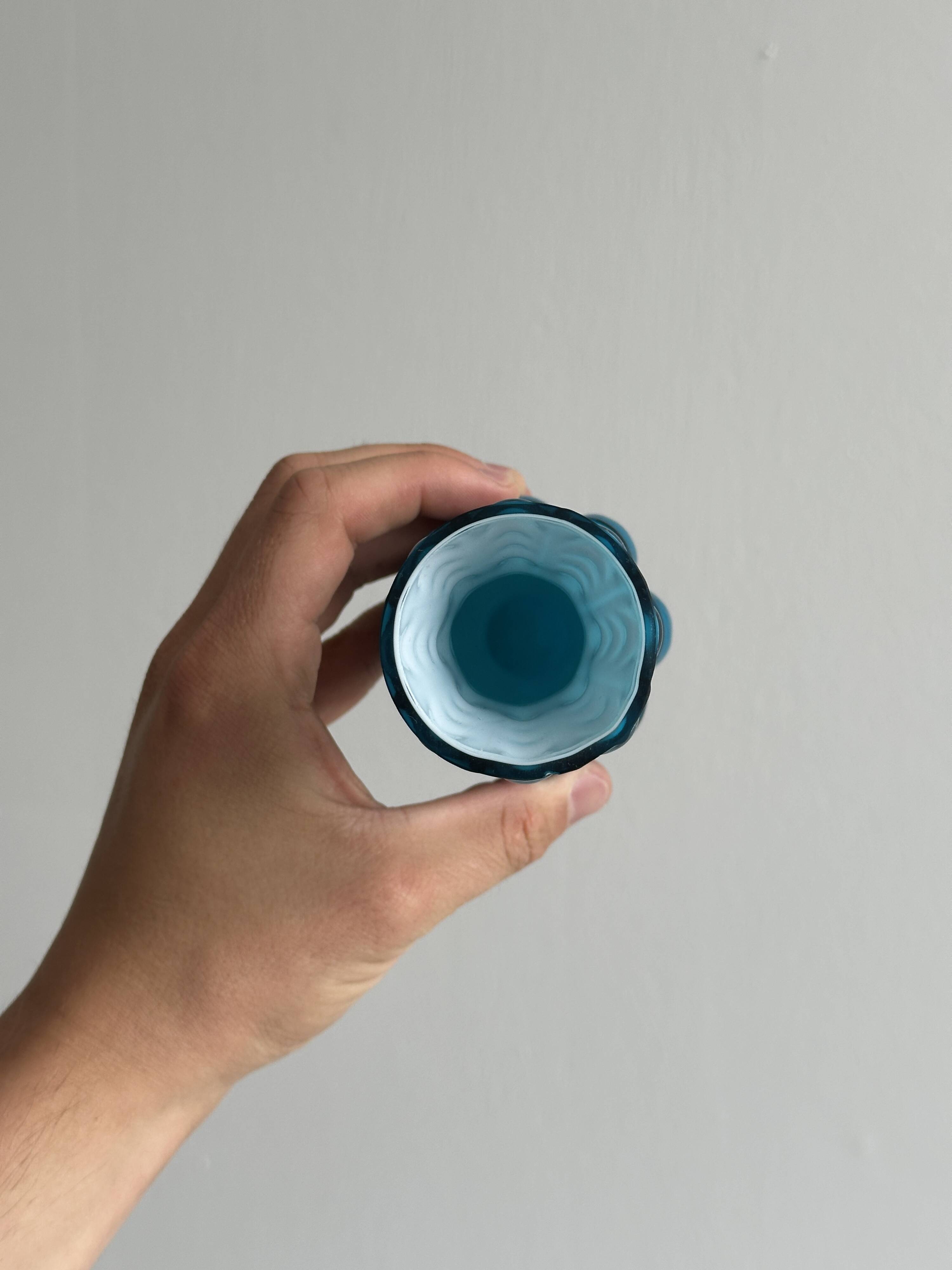Small deep blue vase with reliefs