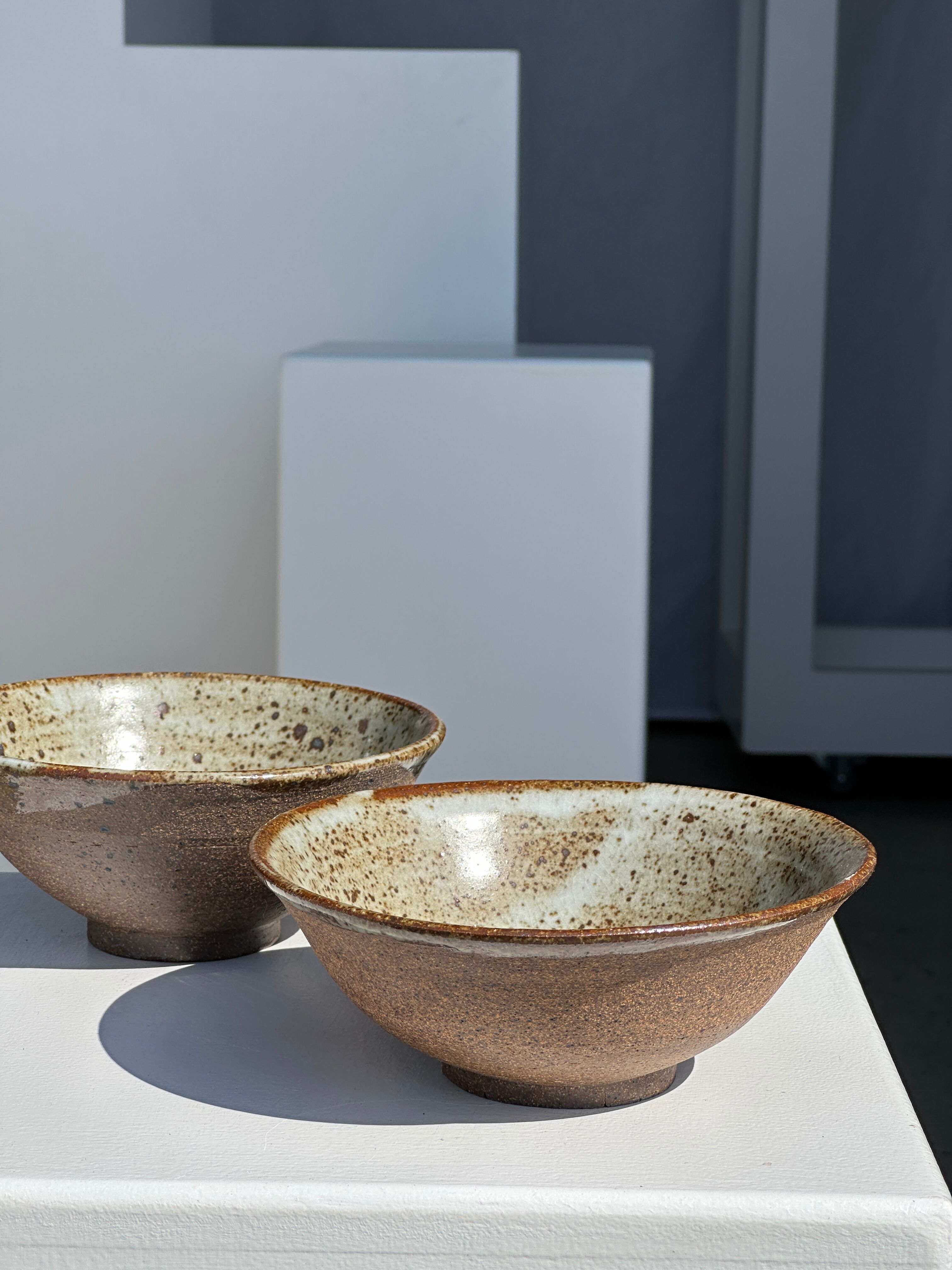 Duo of ceramic bowls interior glazed exterior matt raw earth