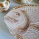 Many flat plates, dish, sauce boat, vegetable dish.