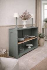 Vintage workshop furniture transformed into a re-enchanted bookshelf in smoky green.