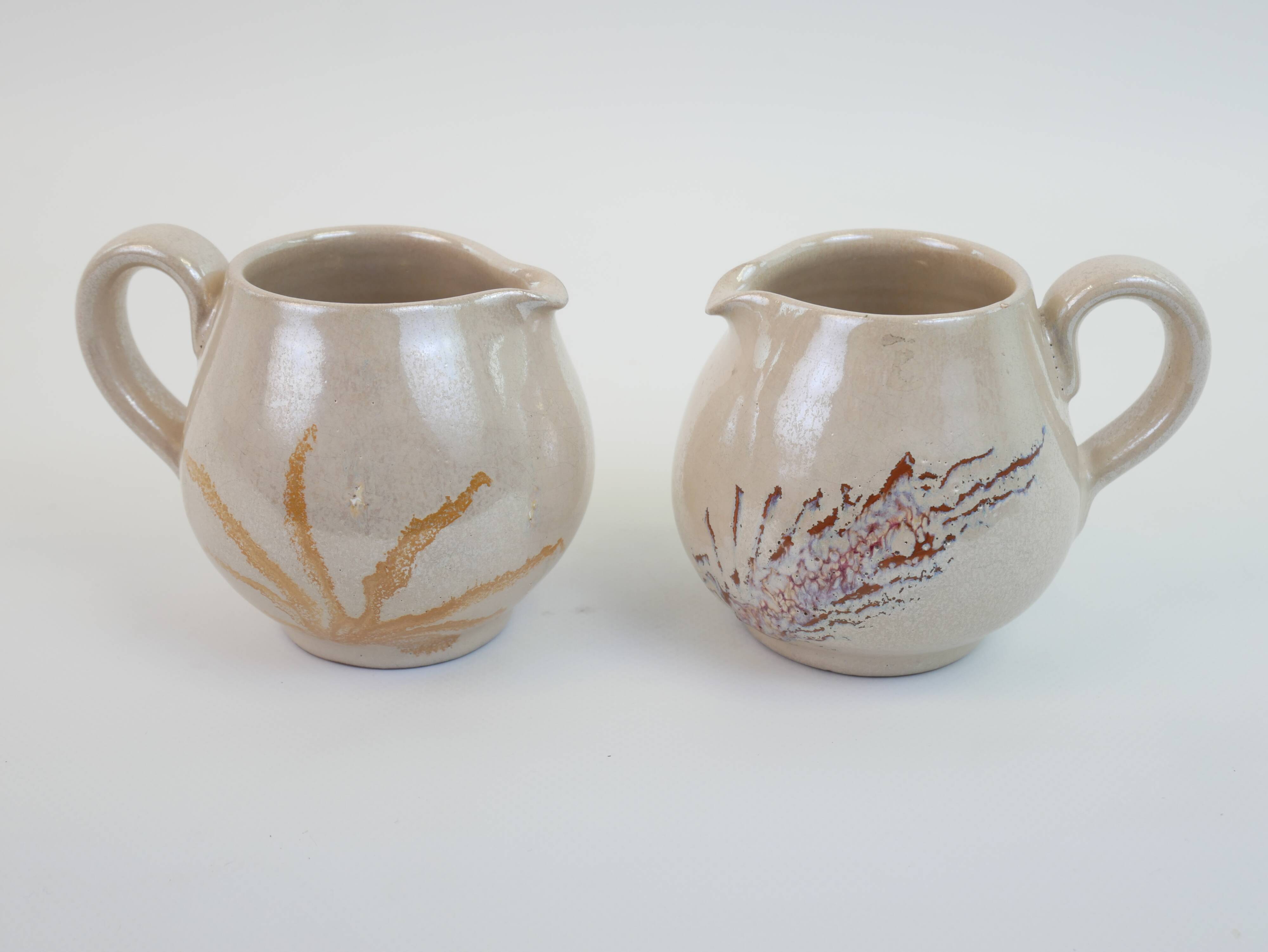 Pair of ceramic milk jugs signed La Roue Vallauris