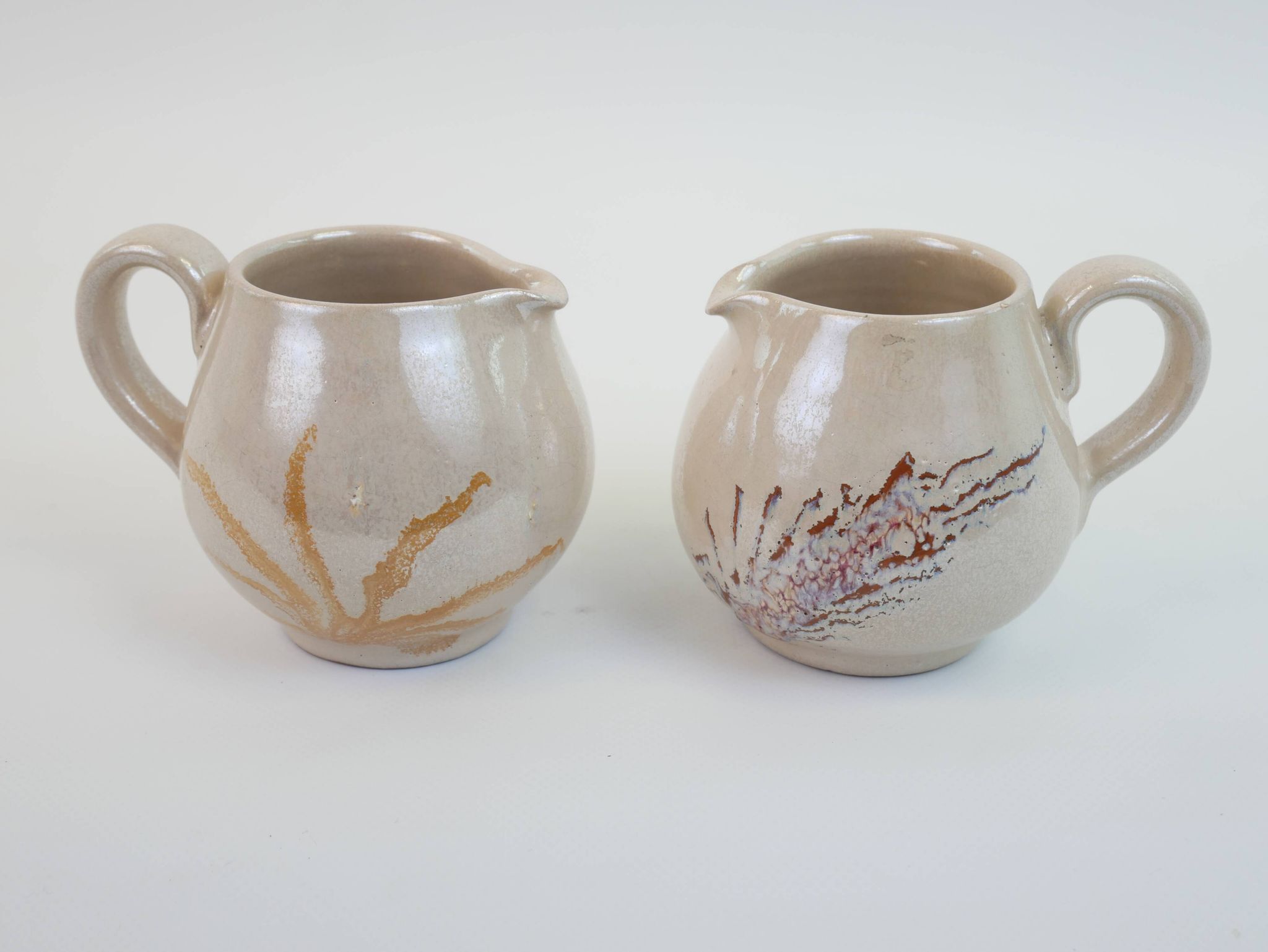 Pair of ceramic milk jugs signed La Roue Vallauris