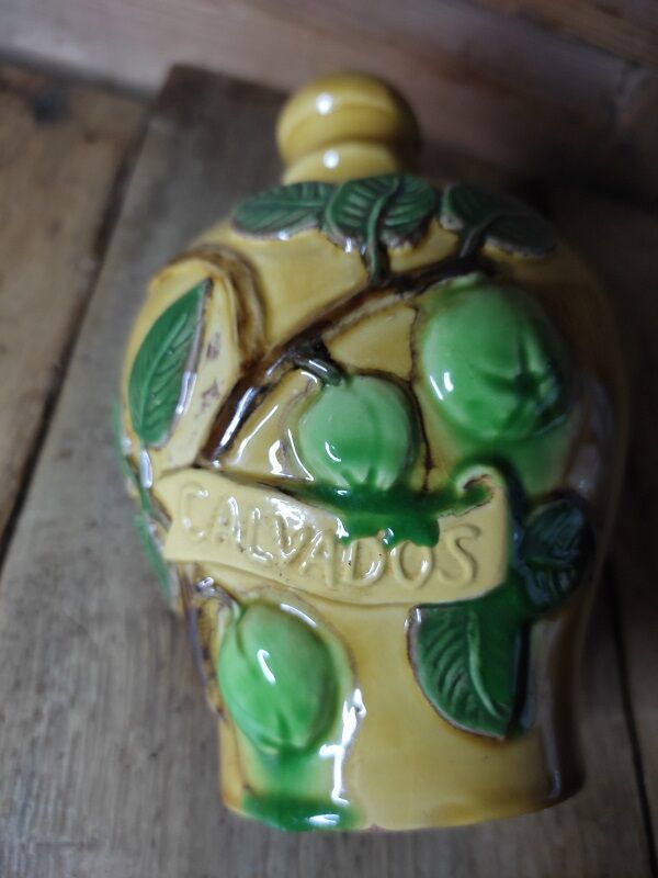 Calvados decanter in vintage antique ceramic