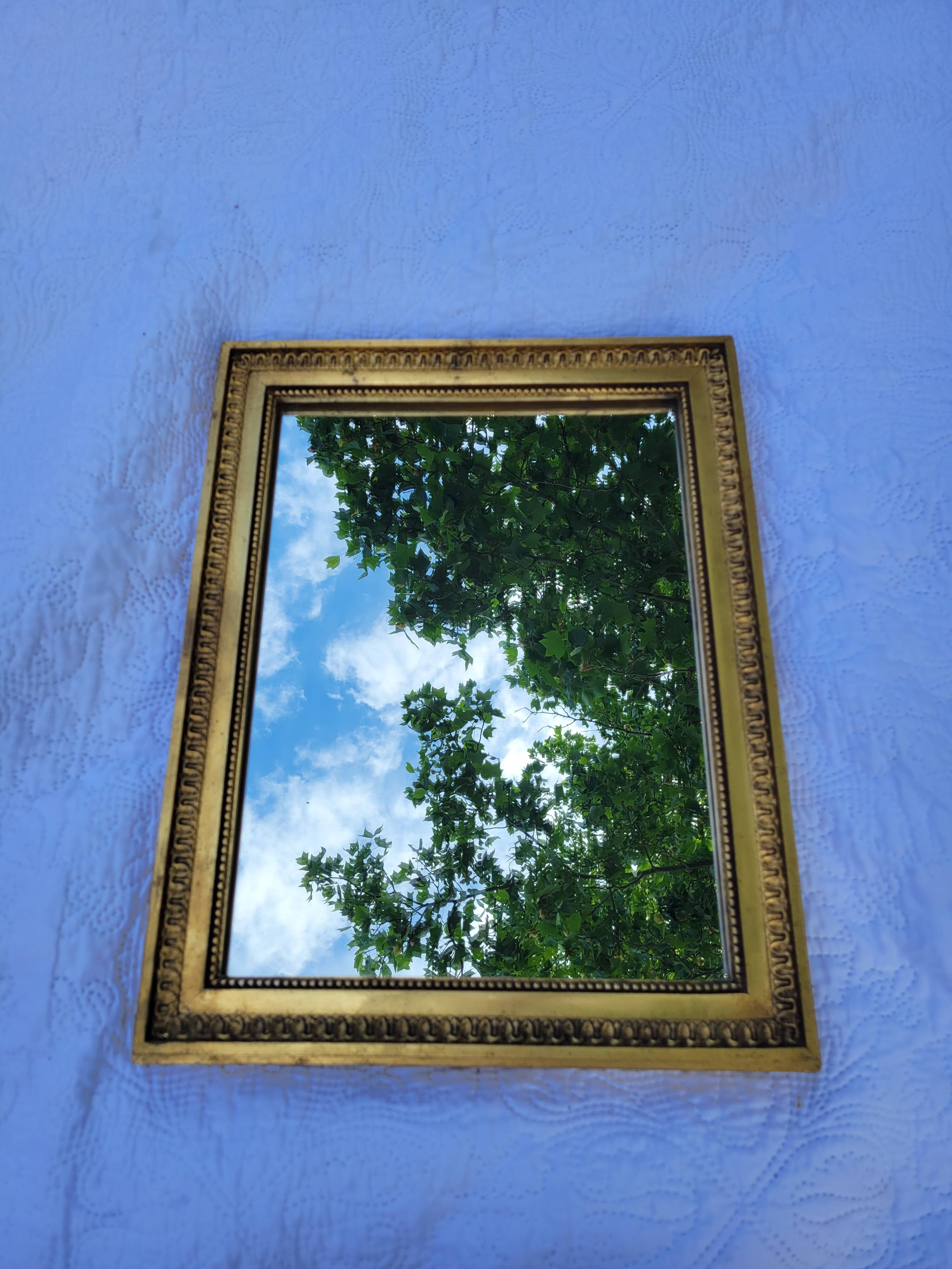 Old mirror in gilded wood