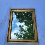 Old mirror in gilded wood