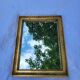 Old mirror in gilded wood