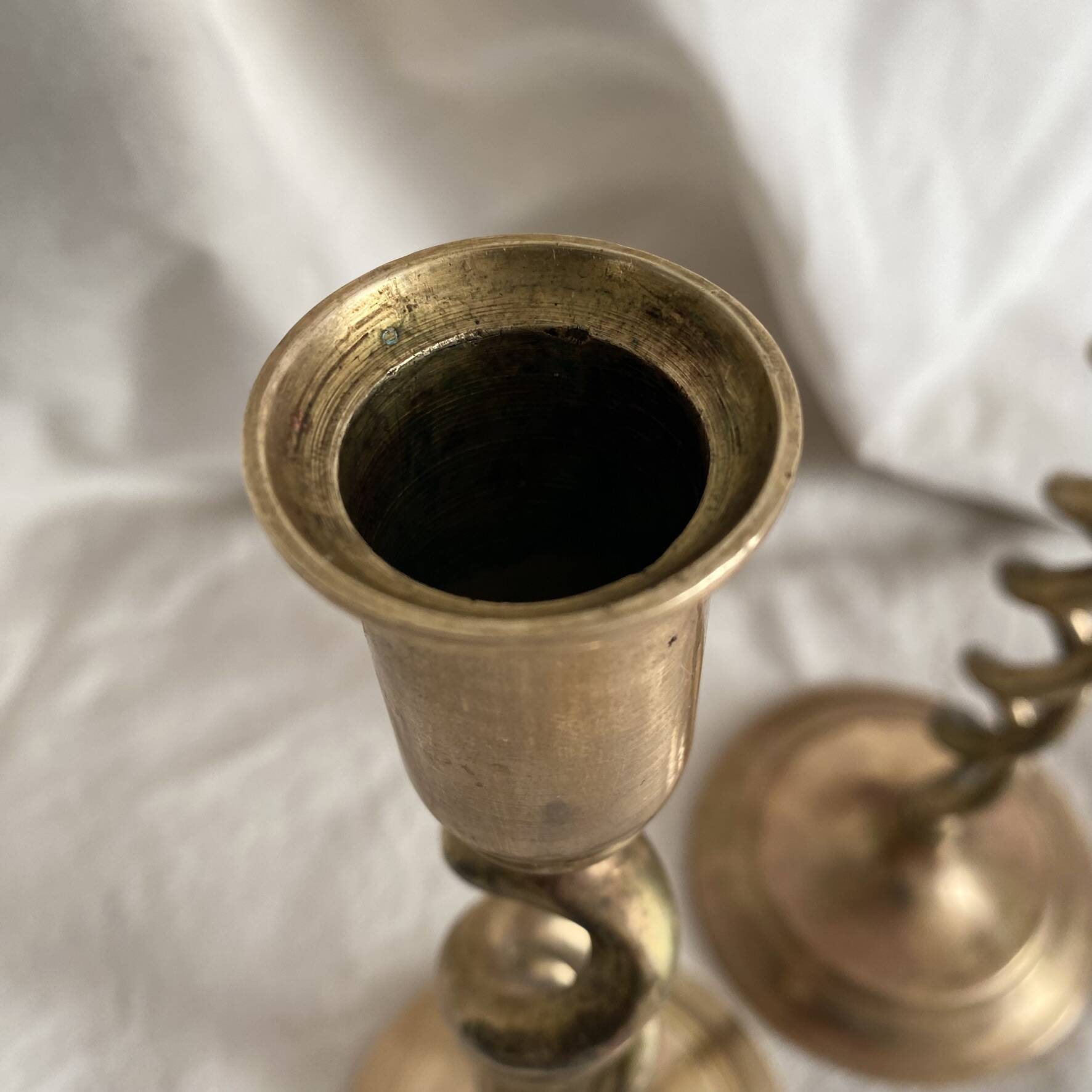 Pair of twisted brass candlesticks