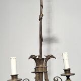 Empire-style bronze chandelier with 3 arms of light topped with eagle heads. French work. Circa 1900.
