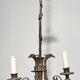Empire-style bronze chandelier with 3 arms of light topped with eagle heads. French work. Circa 1900.