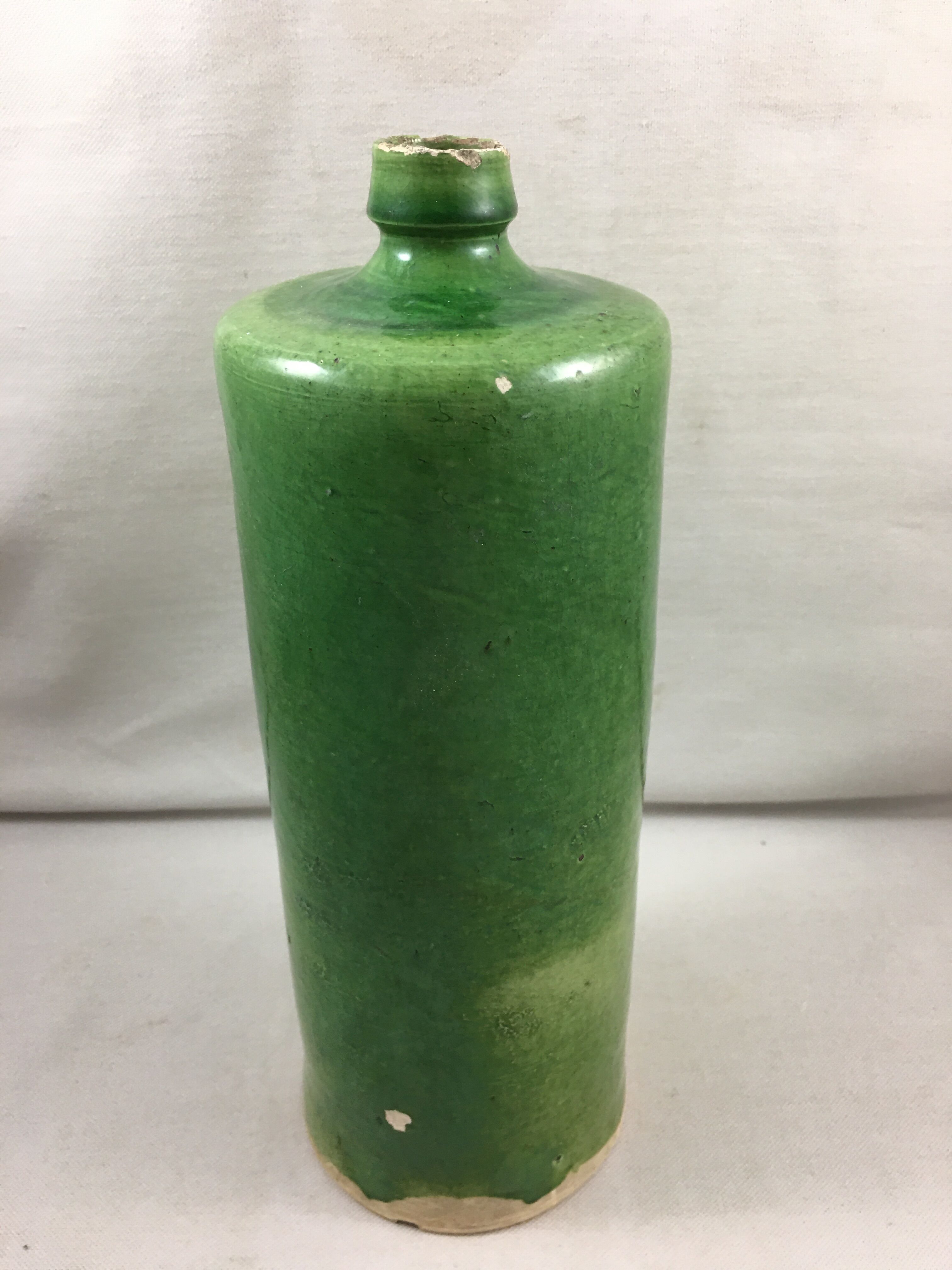 Green glazed terracotta bottle deco