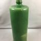 Green glazed terracotta bottle deco