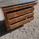 Antique chest of drawers with a grey marble top.