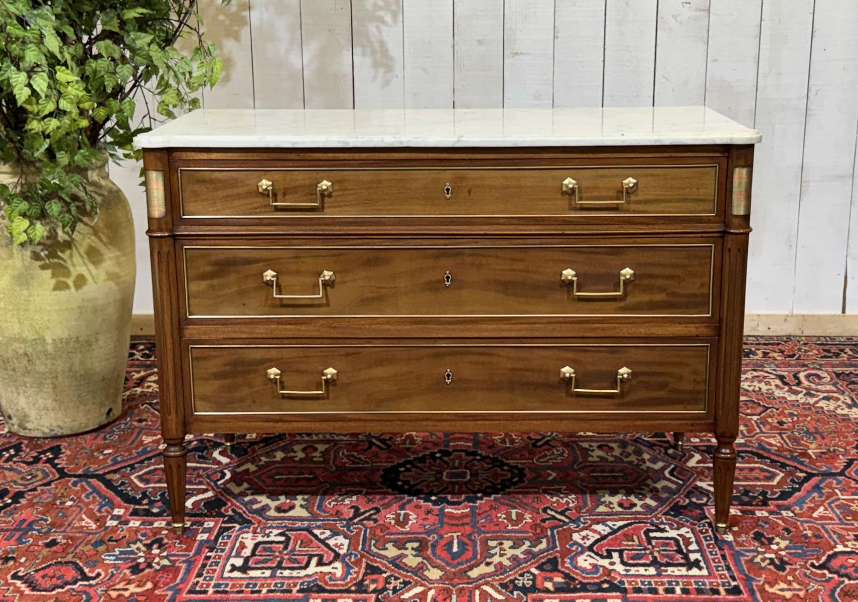 Louis XVI commode in mahogany with a marble top from the 1950s.