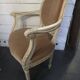 Louis XVI style bergère armchair in patinated wood