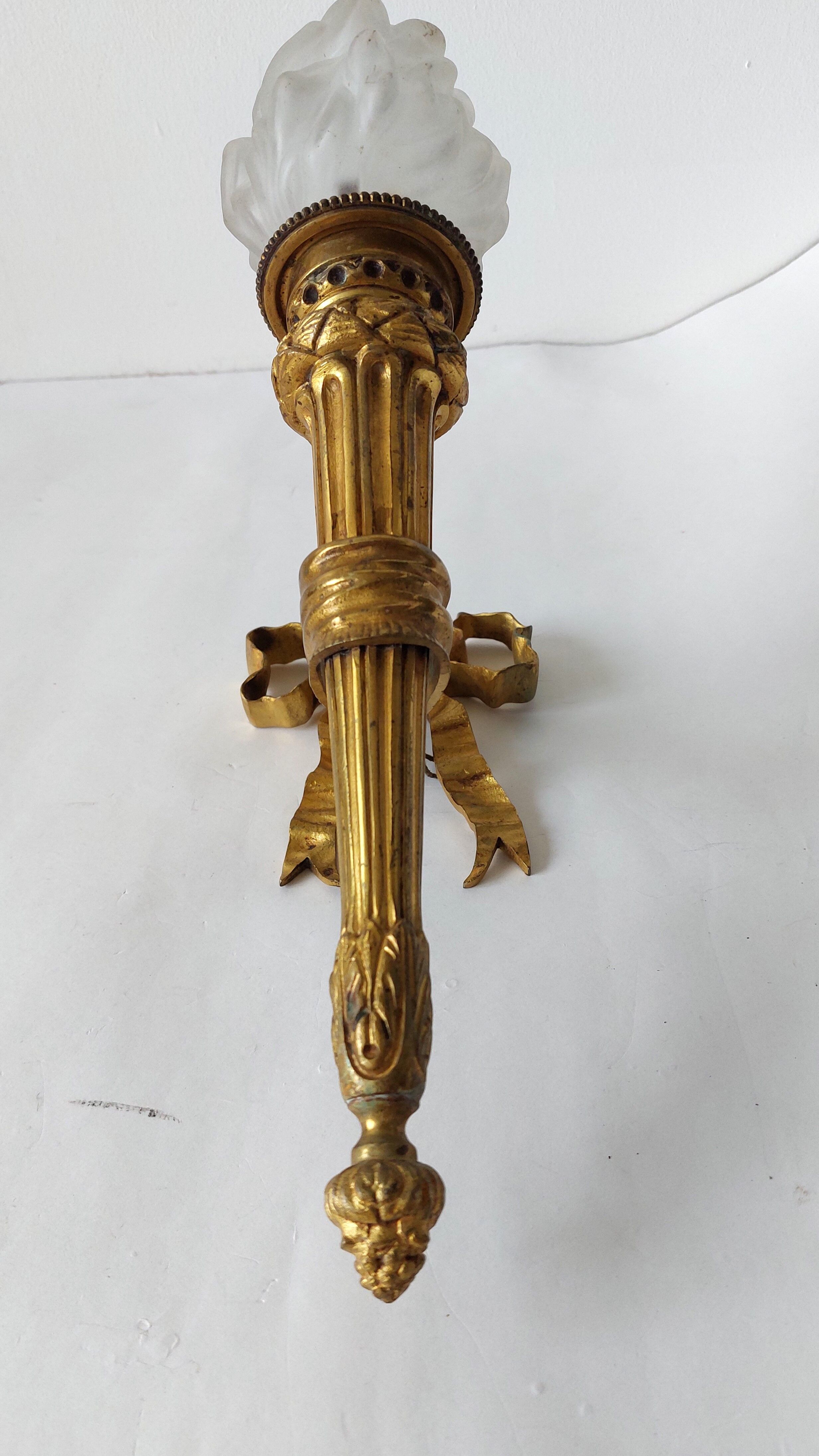 Torch wall lamp in gilded bronze Louis XVI Circa Napoleon III style.