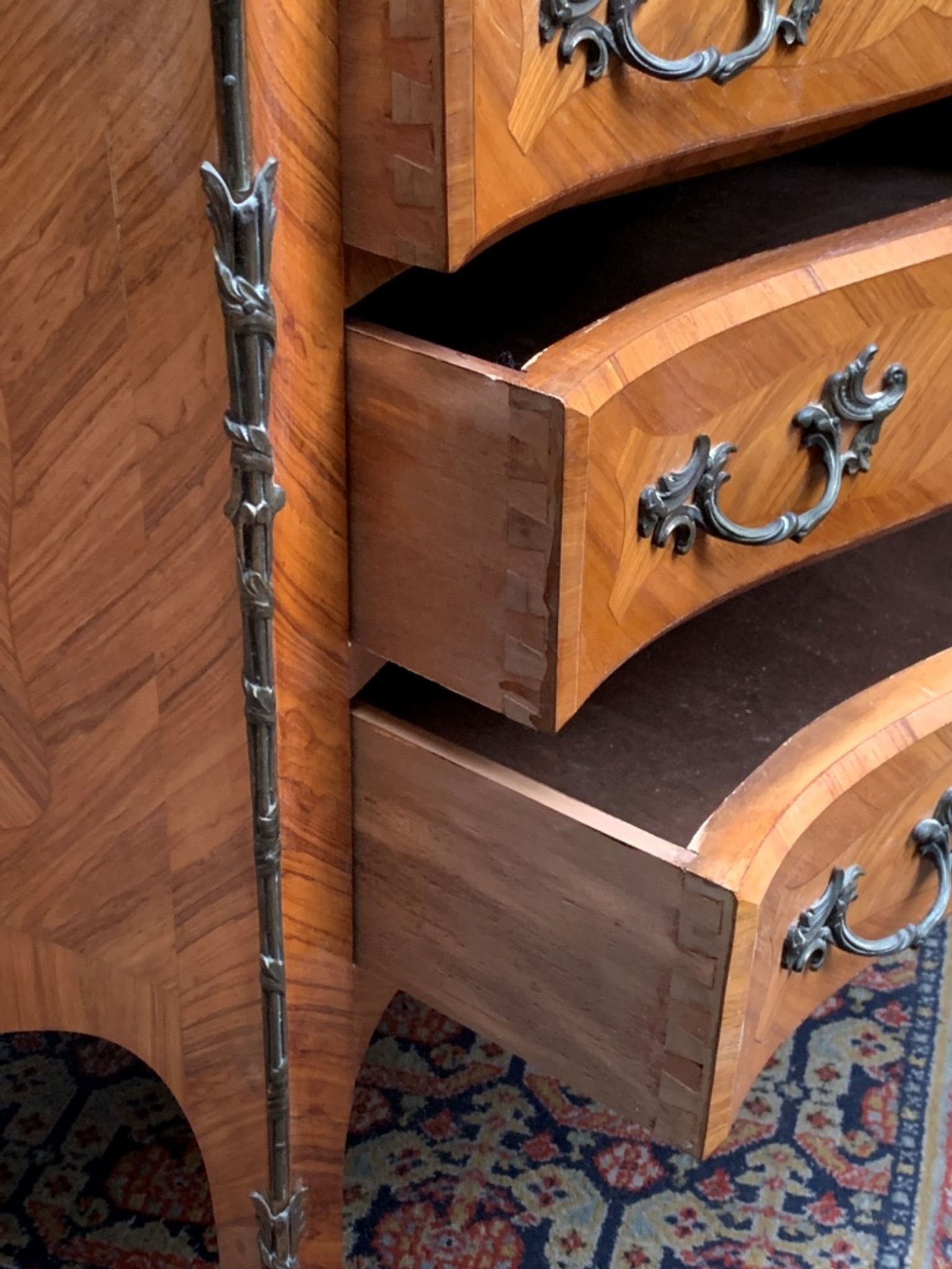 Old French secretary in bronze and wood marquetry.
